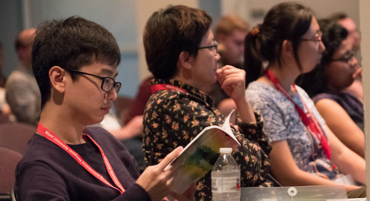 danyang li and other students in audience at symposium